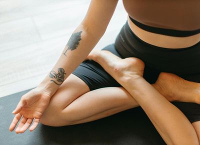 Close-up of a person's feet on a mat, showing focus.